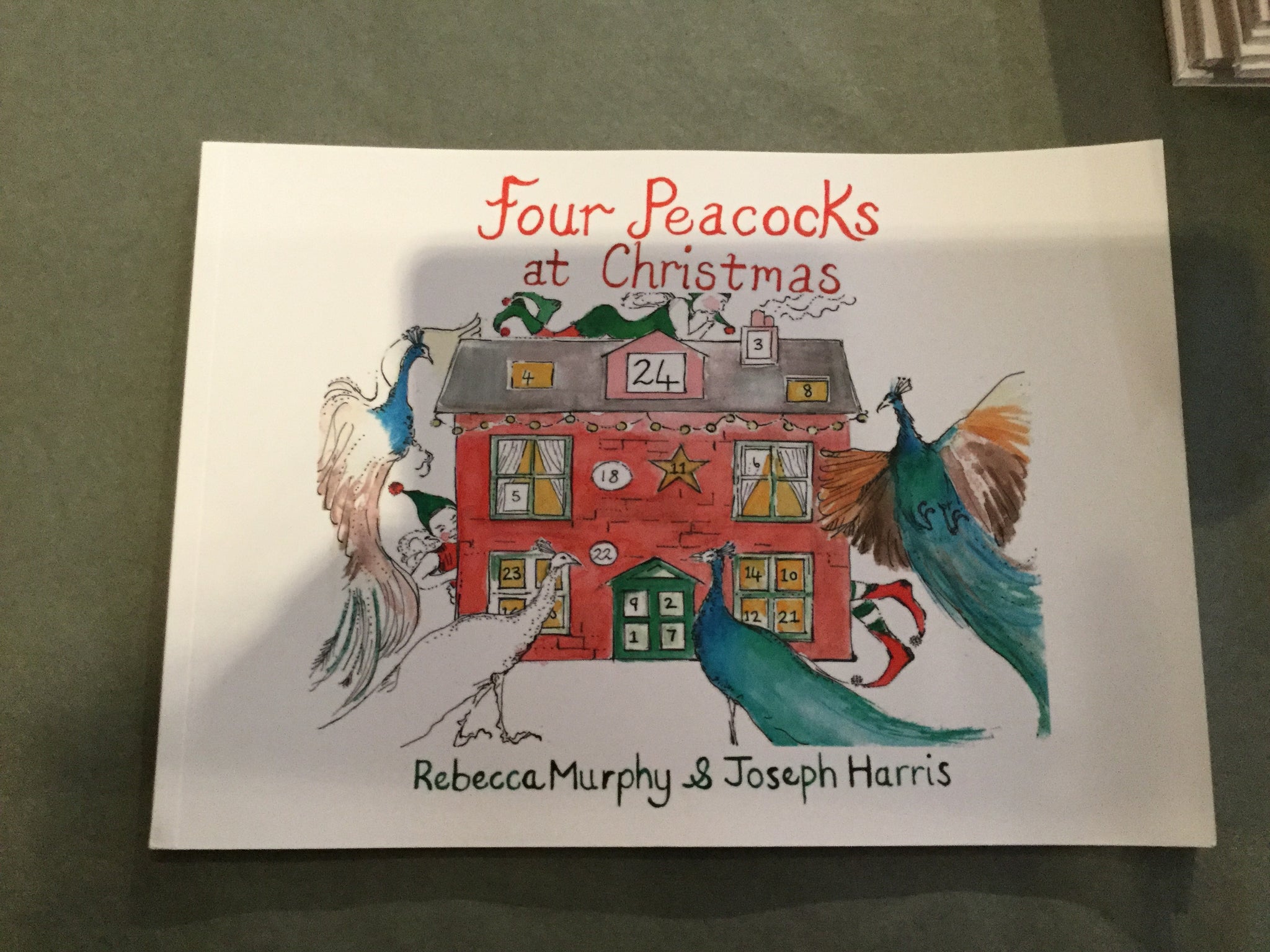 Four Peacocks at Christmas book
